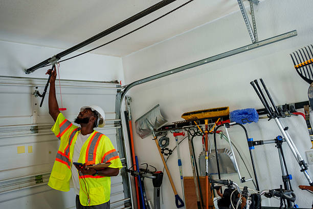 Professional Garage Door Panel Replacement technician working in Manly, IA